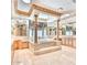 An opulent bathroom with and vanities, a large tub, pillars, and a skylight at 7630 E Vaquero Dr, Scottsdale, AZ 85258