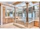 A luxury bathroom with a soaking tub, & sinks, vanities, and decorative mirrors at 7630 E Vaquero Dr, Scottsdale, AZ 85258