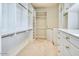 Spacious walk-in closet with built-in shelving and dresser at 7630 E Vaquero Dr, Scottsdale, AZ 85258