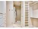 Walk-in closet with multiple shelves and custom storage solutions at 7630 E Vaquero Dr, Scottsdale, AZ 85258