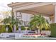 Grand entrance showing meticulously landscaped flowers and plants leading up to a covered portico at 7630 E Vaquero Dr, Scottsdale, AZ 85258