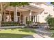 Exterior featuring a lush lawn, mature trees, and detailed stonework landscaping at 7630 E Vaquero Dr, Scottsdale, AZ 85258