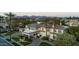 A luxury estate featuring a porte cochere, lush landscaping, and mountain views at 7630 E Vaquero Dr, Scottsdale, AZ 85258