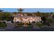 A luxury estate showcasing manicured landscaping, porte cochere, and architectural details at 7630 E Vaquero Dr, Scottsdale, AZ 85258