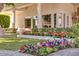 Well-manicured lawn and colorful flowerbeds accentuates this charming property's exterior at 7630 E Vaquero Dr, Scottsdale, AZ 85258