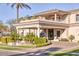 Stately home featuring manicured landscaping, a circular drive, and an impressive covered entryway at 7630 E Vaquero Dr, Scottsdale, AZ 85258