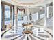 Elegant foyer with marble floors, a grand staircase, and a decorative table centerpiece at 7630 E Vaquero Dr, Scottsdale, AZ 85258