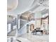 An elegant foyer with a grand staircase, marble floors, high ceilings, and a grand piano at 7630 E Vaquero Dr, Scottsdale, AZ 85258