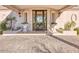 Front entrance to the property with a paved driveway, planter boxes, and beautiful curb appeal at 7630 E Vaquero Dr, Scottsdale, AZ 85258