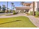 Expansive estate featuring a circular drive, porte cochere, and manicured landscaping at 7630 E Vaquero Dr, Scottsdale, AZ 85258