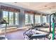 Bright home gym with carpeted floors and a wall of windows for a view, complete with workout equipment at 7630 E Vaquero Dr, Scottsdale, AZ 85258