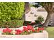 Landscaped yard featuring colorful flower beds, manicured bushes, and mature trees at 7630 E Vaquero Dr, Scottsdale, AZ 85258
