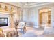 A beautifully decorated living room featuring a fireplace, built-ins, and refined seating at 7630 E Vaquero Dr, Scottsdale, AZ 85258