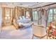 A luxurious main bedroom suite features an ornate four-poster bed, drapery, and elegant furnishings at 7630 E Vaquero Dr, Scottsdale, AZ 85258