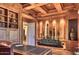 Elegant office with custom millwork, built in book shelves and desk at 7630 E Vaquero Dr, Scottsdale, AZ 85258