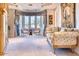 Sitting room with large windows, plush seating, and elegant draperies at 7630 E Vaquero Dr, Scottsdale, AZ 85258