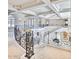 Elegant staircase with decorative iron railings and abundant natural light at 7630 E Vaquero Dr, Scottsdale, AZ 85258