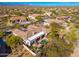 Wide aerial view of a desert home with a pool, patio, and beautifully landscaped backyard in a serene setting at 8427 E Preserve Way, Scottsdale, AZ 85266