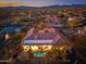 Luxury home with a private pool and outdoor living area, nestled in a scenic desert landscape with distant mountains at 8427 E Preserve Way, Scottsdale, AZ 85266