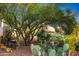 Backyard with desert landscaping, cacti, and a quaint seating area at 8427 E Preserve Way, Scottsdale, AZ 85266