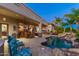 Inviting backyard featuring a pool, covered patio, and outdoor dining area perfect for entertaining at 8427 E Preserve Way, Scottsdale, AZ 85266