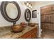 Bathroom with double sinks, granite countertops, and walk-in shower at 8427 E Preserve Way, Scottsdale, AZ 85266