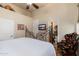 Bedroom boasts a wrought iron bed frame and an ensuite bathroom at 8427 E Preserve Way, Scottsdale, AZ 85266