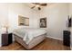 Bedroom with neutral tones, wood floors, ceiling fan and natural light at 8427 E Preserve Way, Scottsdale, AZ 85266