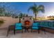 Relaxing outdoor fireplace area with comfortable seating, perfect for enjoying cool evenings at 8427 E Preserve Way, Scottsdale, AZ 85266