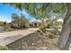 Beautiful single-story home featuring a long driveway and mature desert landscaping at 8427 E Preserve Way, Scottsdale, AZ 85266