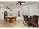 Spacious game room with pool table, ceiling fans, and plenty of seating at 8427 E Preserve Way, Scottsdale, AZ 85266