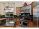 A kitchen featuring custom cabinetry, stainless steel appliances, and granite countertops at 8427 E Preserve Way, Scottsdale, AZ 85266