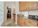 Laundry room with wood cabinets, granite countertops, and walk-in closet at 8427 E Preserve Way, Scottsdale, AZ 85266