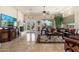 Spacious living room featuring a fireplace, sofas, an area rug, and French doors with views of the outdoors at 8427 E Preserve Way, Scottsdale, AZ 85266