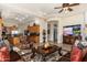 Spacious living room featuring a coffered ceiling, decorative furniture, and tile floors at 8427 E Preserve Way, Scottsdale, AZ 85266