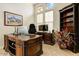 The office features a large window, built-in shelving, and an executive desk at 8427 E Preserve Way, Scottsdale, AZ 85266