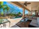 Covered patio offers ample seating with views of the pool, spa, and lush desert landscaping at 8427 E Preserve Way, Scottsdale, AZ 85266