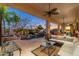 Spacious covered patio offers seamless indoor-outdoor living with a view of the serene pool area at 8427 E Preserve Way, Scottsdale, AZ 85266