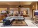 The covered patio provides a comfortable outdoor living space with stylish furniture and ceiling fan at 8427 E Preserve Way, Scottsdale, AZ 85266
