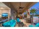 This covered patio has ample seating, including easy access to the living room and a built-in grill at 8427 E Preserve Way, Scottsdale, AZ 85266