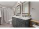 Double sink bathroom vanity with mirror and mosaic tile at 8750 E Starlight Way, Scottsdale, AZ 85250
