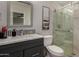 Modern bathroom with glass shower door, decorative tile, and contemporary vanity at 8750 E Starlight Way, Scottsdale, AZ 85250