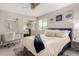 Bright bedroom featuring a bed with a desk, mirror closet doors and light grey interior at 8750 E Starlight Way, Scottsdale, AZ 85250