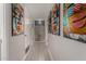 Hallway with light tile floors and modern art at 8750 E Starlight Way, Scottsdale, AZ 85250
