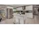 Bright kitchen featuring an island with barstool seating, white cabinets, and stainless appliances at 8750 E Starlight Way, Scottsdale, AZ 85250