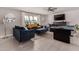 A spacious living room with an entertainment center, pool table, and modern furniture at 8750 E Starlight Way, Scottsdale, AZ 85250