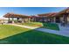 Large backyard with grass, outdoor grill and patio space, and a shaded eating area at 8751 S 168Th Dr, Goodyear, AZ 85338