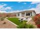 Inviting backyard features lounge seating, built-in BBQ, and a low-maintenance design at 8751 S 168Th Dr, Goodyear, AZ 85338