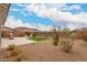 Landscaped backyard with patio, artificial turf, and lounge seating perfect for relaxing at 8751 S 168Th Dr, Goodyear, AZ 85338