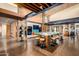 Spacious lobby area with stone columns, beamed ceilings, and communal table and coffee bar at 8751 S 168Th Dr, Goodyear, AZ 85338